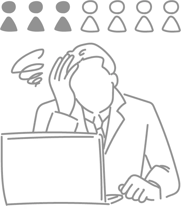 膨大な仕事量と人材不足に悩む男性